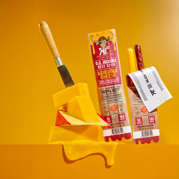 Beef & Cheese next to Cheddar block with knife in it