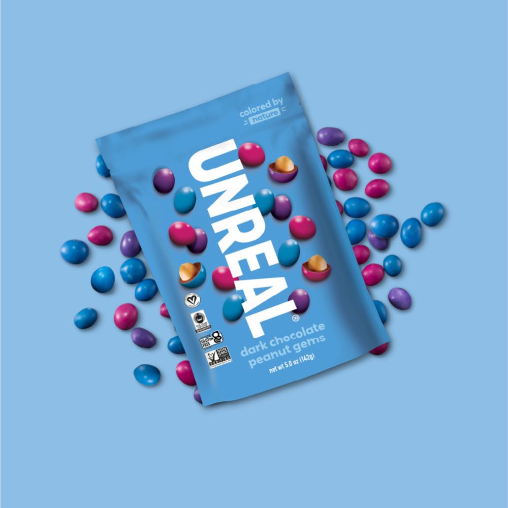UnReal Dark Chocolate Peanut Gems Snack Pack 1.5oz lifestyle image